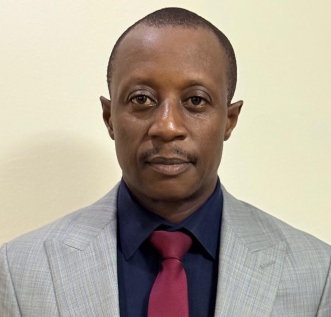 Headshot of Mr. Iliya Barnabas, Founding Official of KCCIMA
